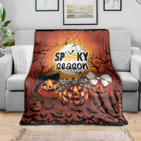 Halloween blanket with “Spooky season” design, jack-o’-lantern pumpkins, bats, and bows