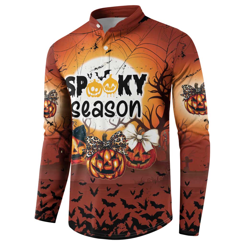Orange Halloween button sweatshirt, front view with pumpkins, bats, and spiderweb pattern