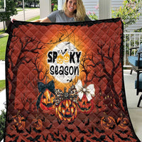 Halloween quilt with orange-and-black spooky season design, pumpkins and bats, diamond stitching