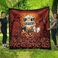 Spooky season Halloween quilt in orange and black with moon graphic, pumpkins, and bats