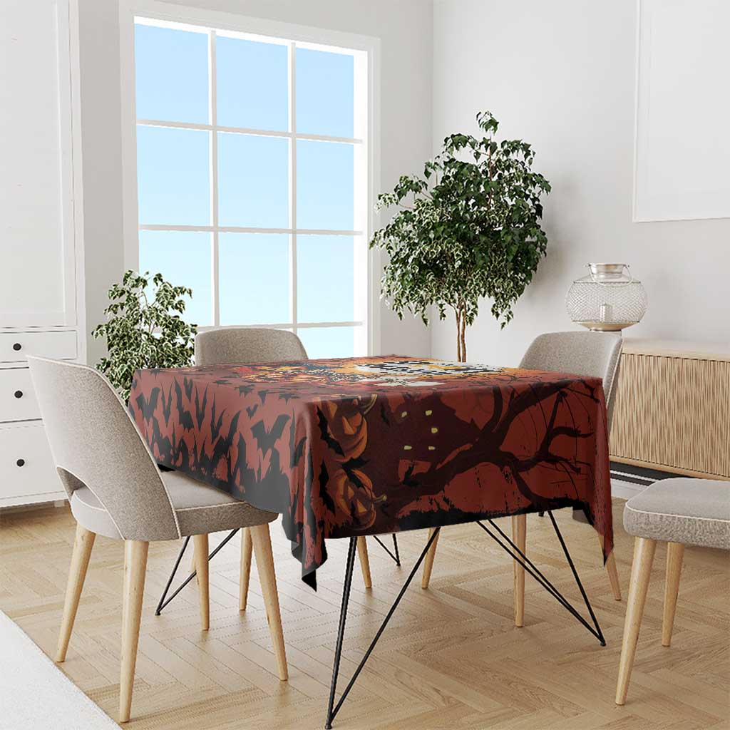 Orange Halloween tablecloth with spooky bat pattern, styled on a dining table