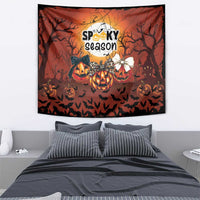 Orange Halloween tapestry featuring “Spooky season,” pumpkins, bats, and tree silhouettes.