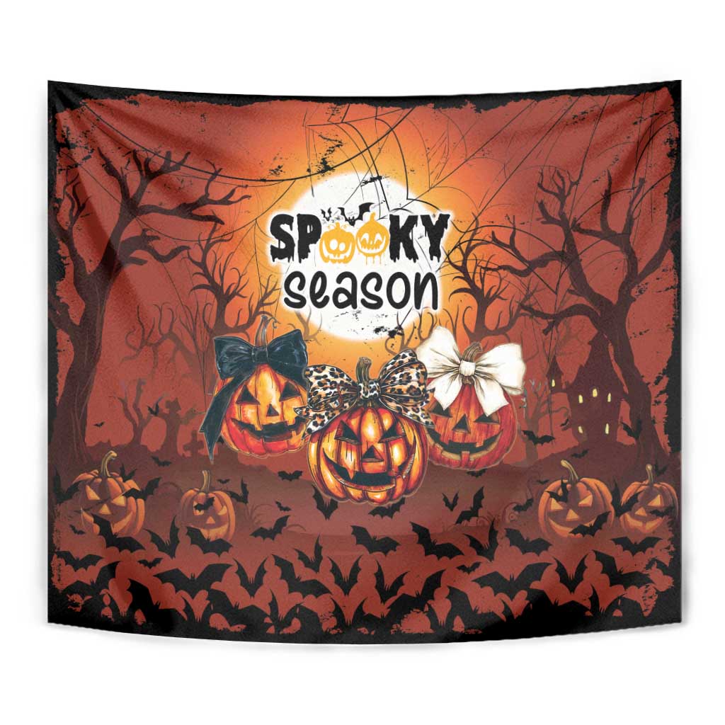 Orange Halloween tapestry with jack-o’-lantern pumpkins, bats, and “Spooky season” centered graphic.