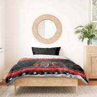 Krampus Christmas bedding set on wooden bed, black duvet with red stripe and character print