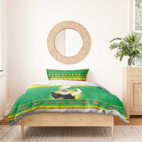 Green Ethiopian Christmas bedding set on bed: Santa figure print with patterned border hem