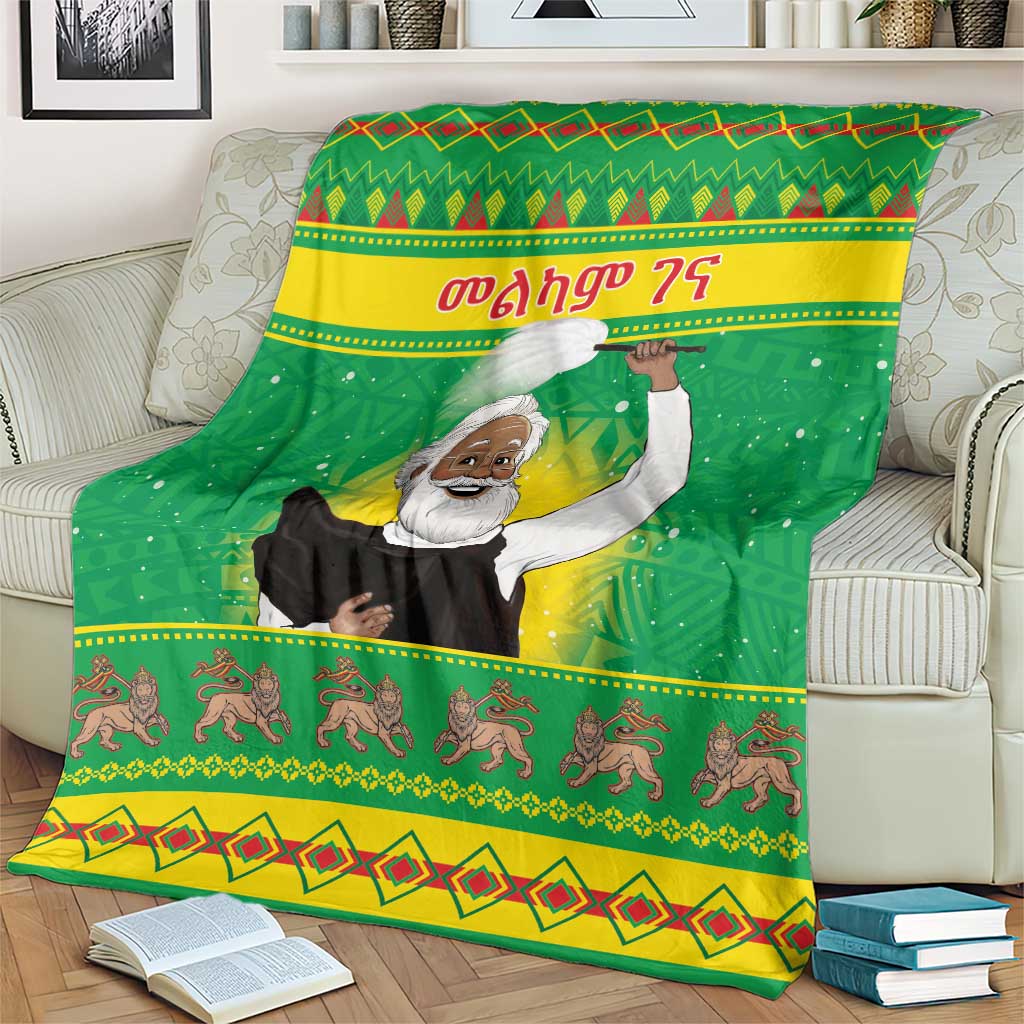 Green Christmas blanket with saint illustration, yellow-green stripes, and horse-like figures
