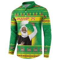 Green button-up sweatshirt with long sleeves and large center graphic on back