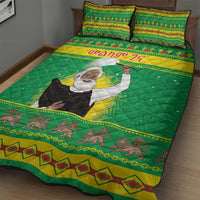 Green Ethiopian quilt bed set with portrait artwork, yellow trim lines, and small animal border