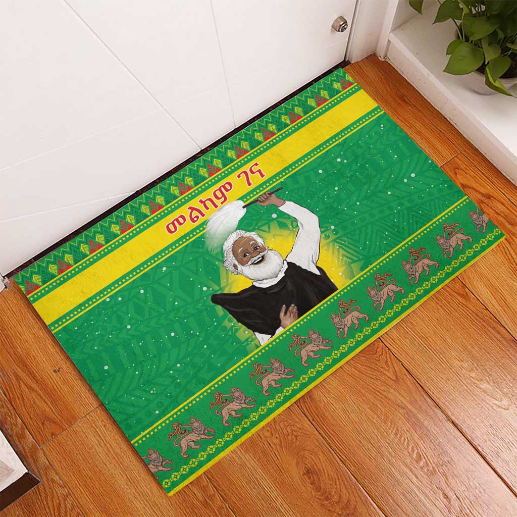 Green rubber doormat with Santa-style figure, textured grid background, bordered pattern