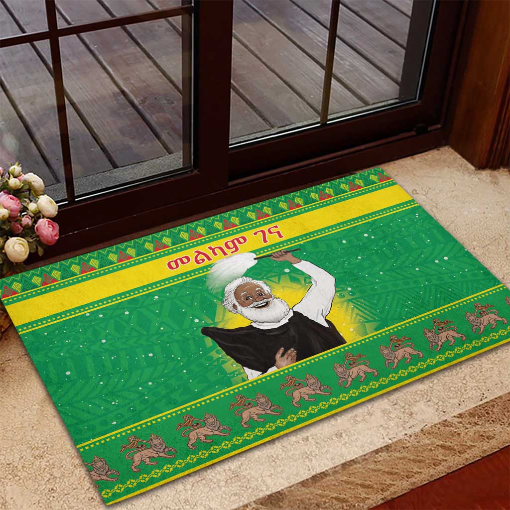 Green rubber Christmas doormat with Santa-style figure and animal motif trim, rectangular