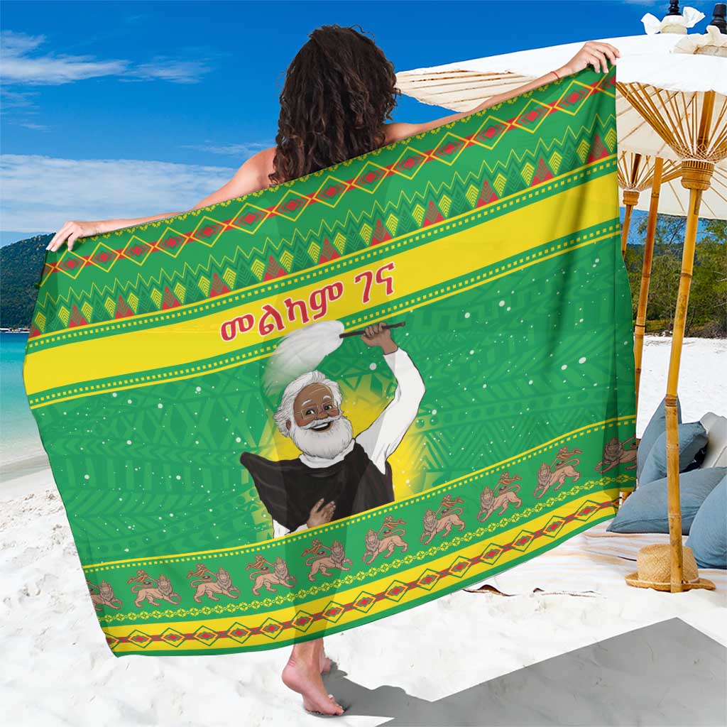 Green sarong with large bearded man portrait and diamond patterned border