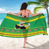 Green sarong with center portrait and diamond animal border, wrap style