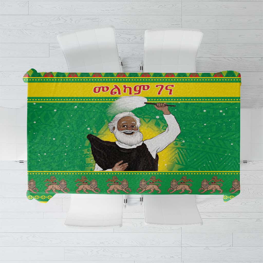 Green Christmas tablecloth with central Santa figure and decorative border pattern