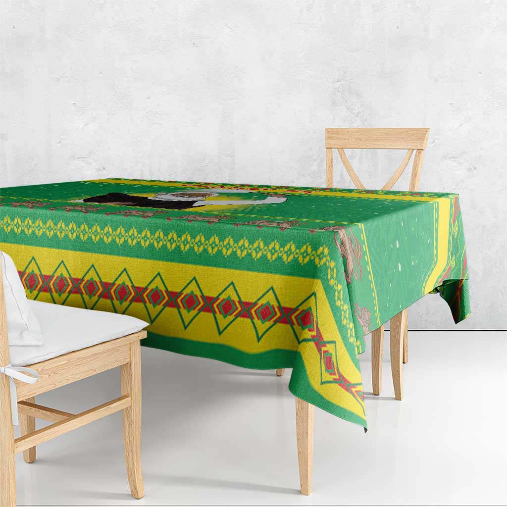 Green Christmas tablecloth corner view with geometric diamond trim and zigzag band