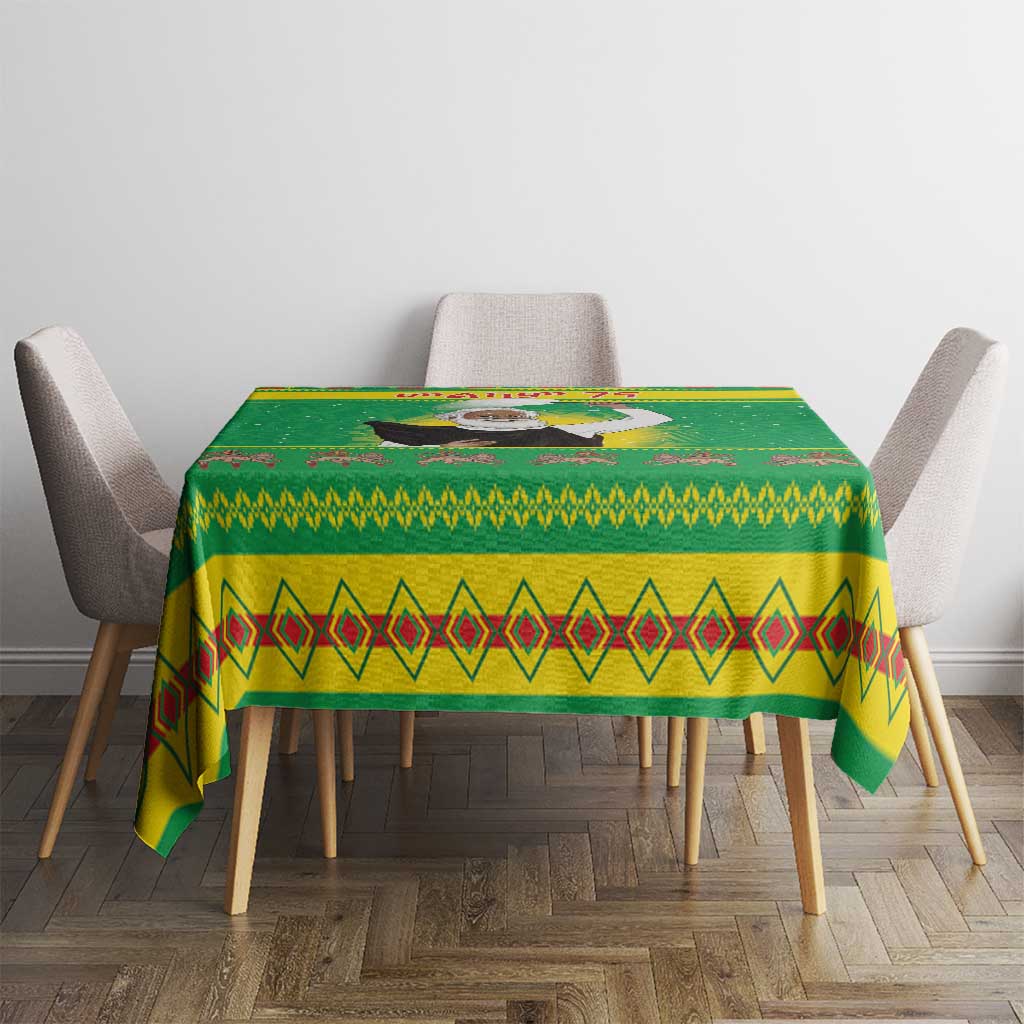 Green Christmas tablecloth on dining table with red diamond stripe border