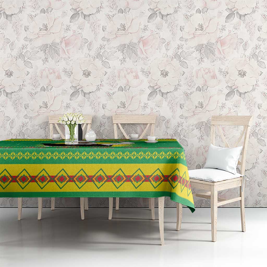Green Christmas tablecloth on dining table with diamond-pattern stripe border