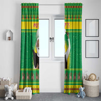 Green window curtains with red diamond top band and printed bearded figure