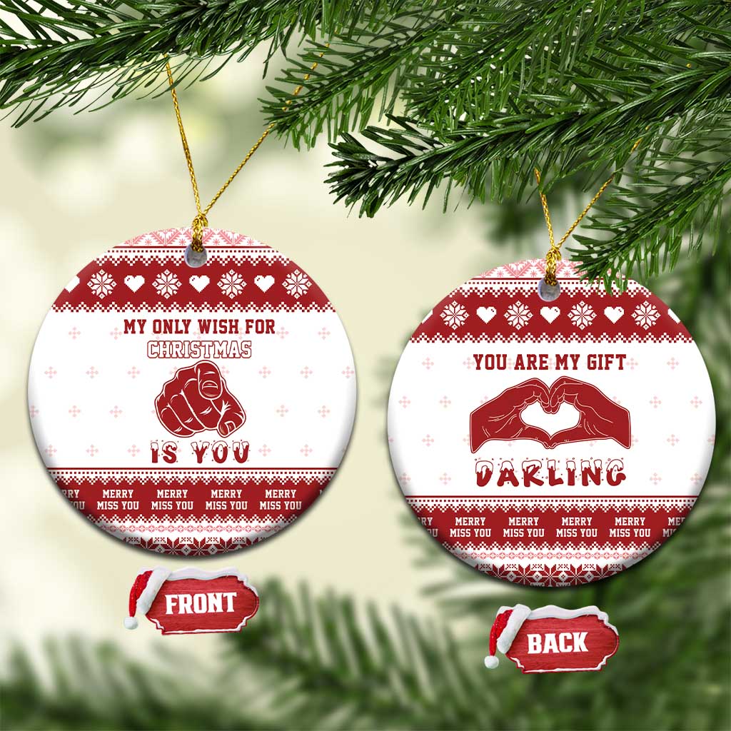 Red-and-white round ceramic Christmas ornaments, “My only wish for Christmas is you” and “You are my gift darling”.