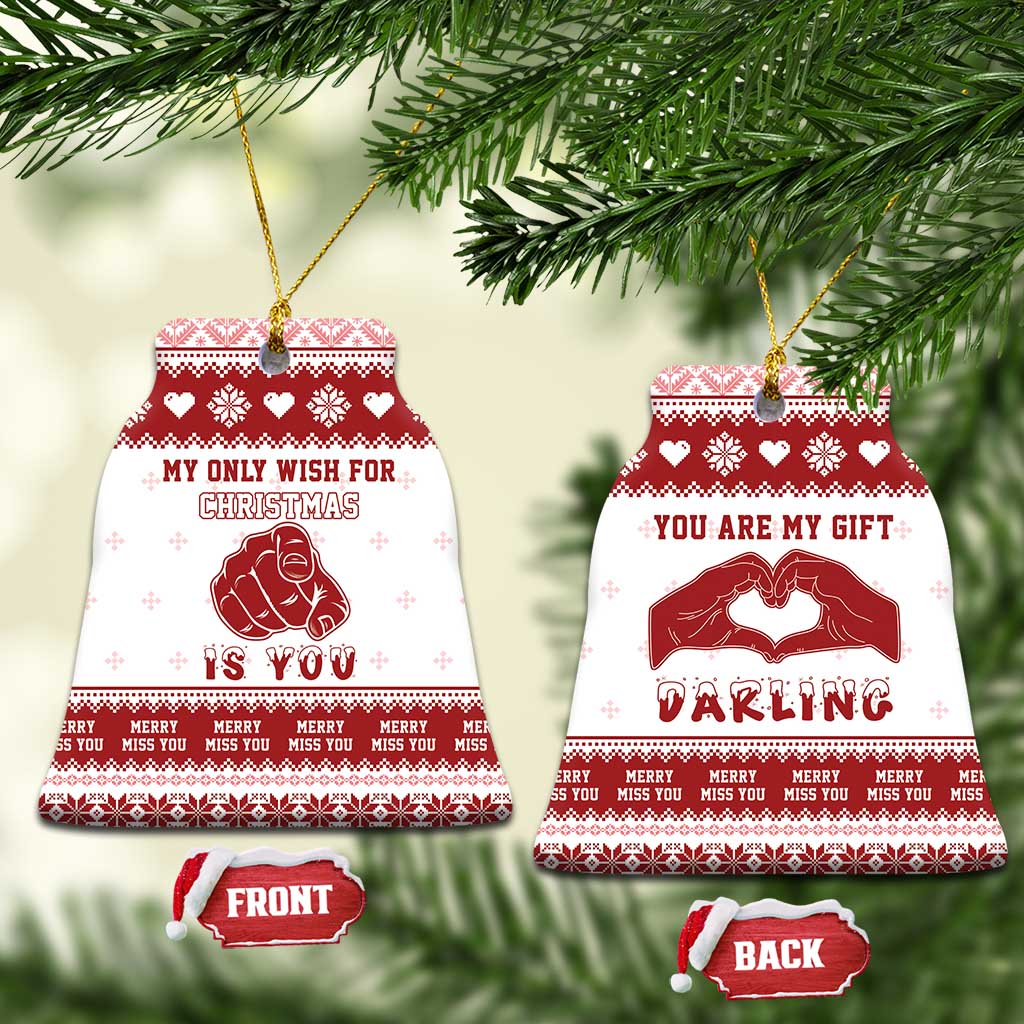 Red-and-white bell-shaped ceramic Christmas ornaments: “My only wish for Christmas is you” and “Darling”.
