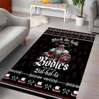 Black holiday area rug with Viking figure and repeating cross-and-sword pattern border