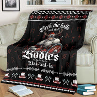 Black Viking-themed throw blanket with red/white design on a living room couch