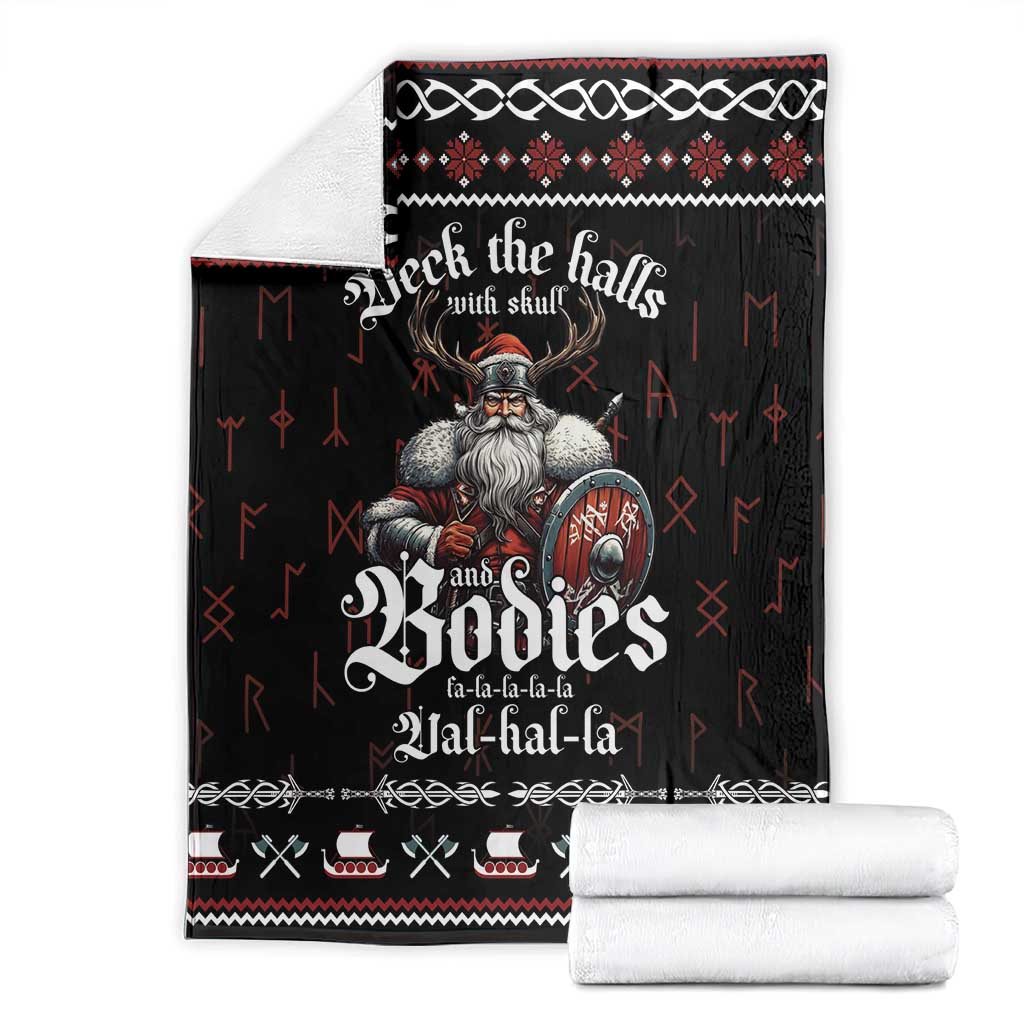 Folded black Christmas blanket with Viking warrior skull graphic and red/white accents