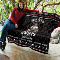 Black Christmas quilt on couch/bench with Viking graphic, white border, and red details.