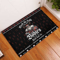 Black rubber doormat in doorway corner with Viking and musical notes pattern