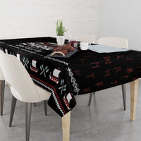 Black Viking holiday tablecloth with red and white trim pattern on tabletop