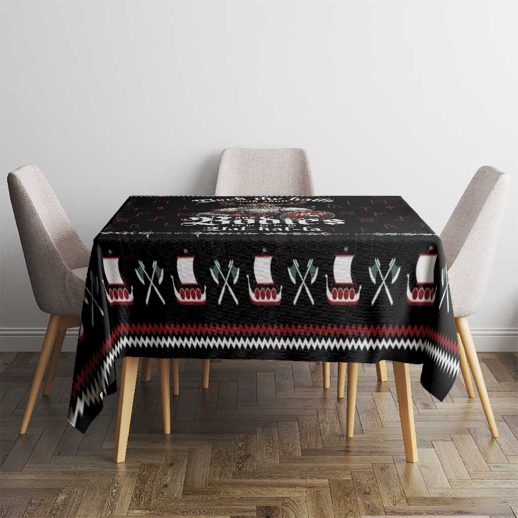 Black Viking holiday tablecloth on a small table, featuring red and white accents