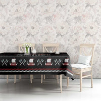 Black Viking holiday tablecloth covering a long table with patterned border