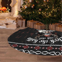 Black round tree skirt with Viking print, red accents, and white fringe edge