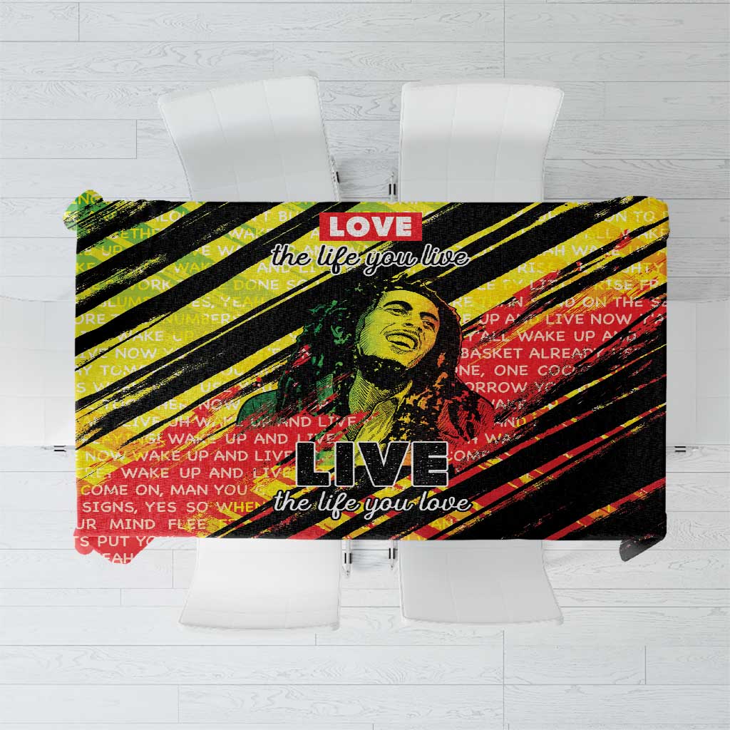 Square tablecloth with bold reggae-style “LIVE” graphic in black, red, yellow, and green stripes