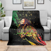 Black reggae graphic blanket with musician portrait, splatter dots, and multicolor stripes