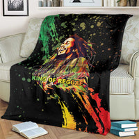 Black graphic throw blanket featuring reggae musician face and colorful spray-streak artwork