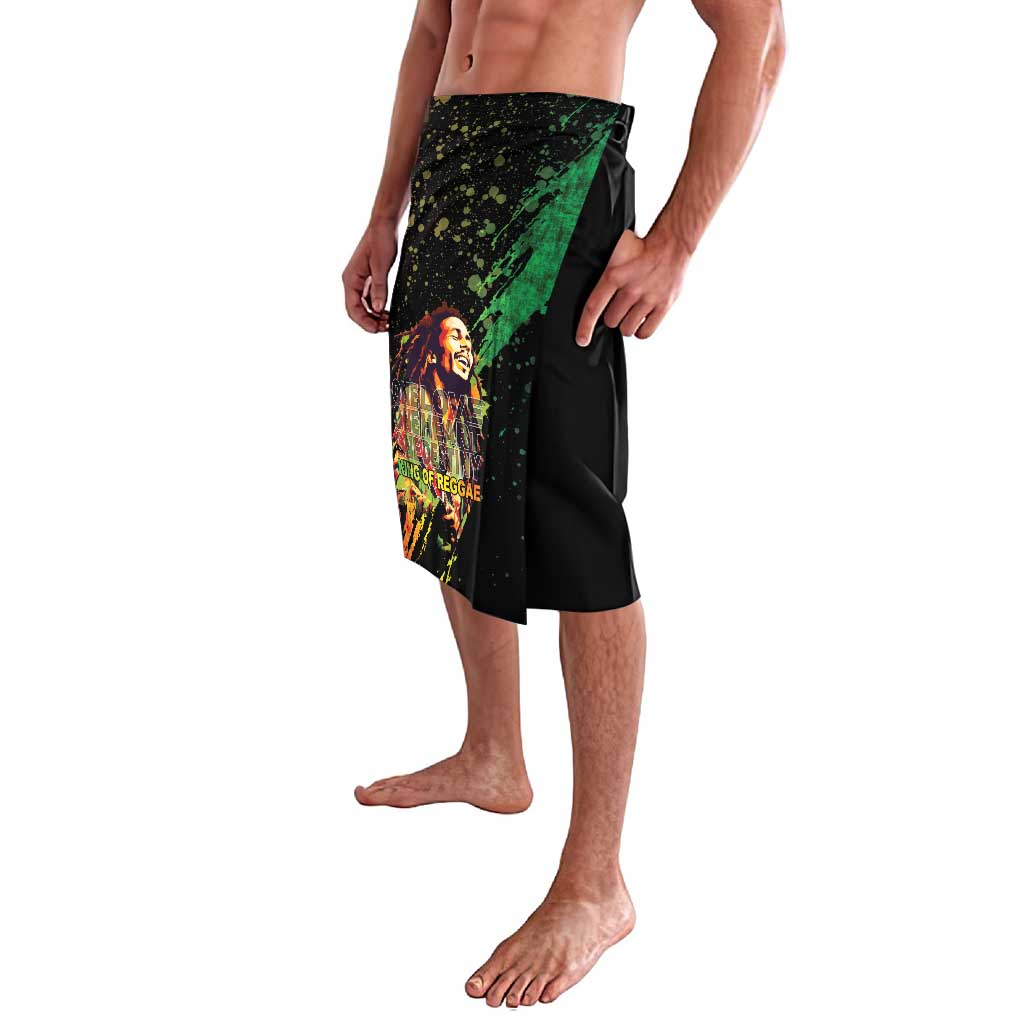 Black printed wrap-style skirt with reggae face graphic and green diagonal panel