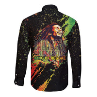 Unisex black long-sleeve button shirt with back reggae graphic, text and splatter accents