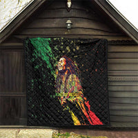 Black quilted wall-hanging throw blanket with reggae king portrait graphic and diamond pattern.