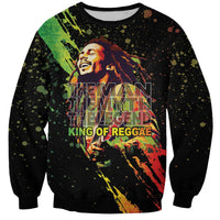 Unisex black crewneck sweatshirt with colorful reggae king graphic and text on front