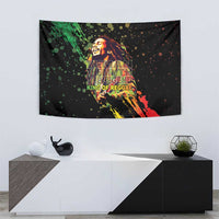 Black tapestry wall hanging with shouting reggae figure and colorful paint-splatter strokes