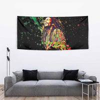 Black tapestry wall hanging with reggae singer artwork and 'King of Reggae' phrase