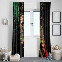 Pair of black window curtains with reggae musician print in green and red streaks