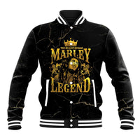 Black baseball jacket with gold lion and reggae graphic, snap-button front and striped cuffs.