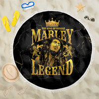 Round black beach blanket with gold “Marley Legend” graphic and white fringe edge