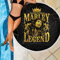 Round black beach blanket with gold “Marley Legend” portrait and white fringe border