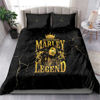 Black duvet bedding set with gold Marley Legend artwork and two pillowcases on a bed