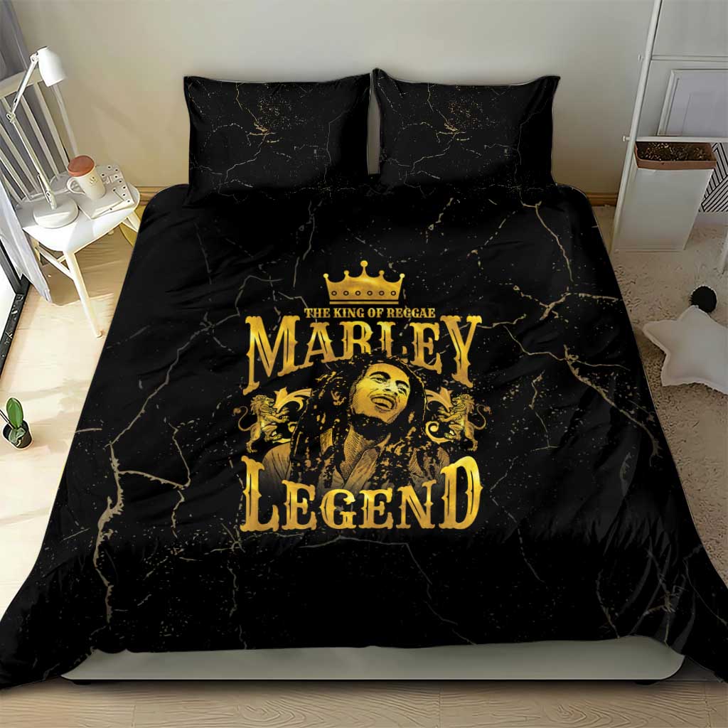 Black bedding set with two pillowcases and gold Marley Legend design centered on duvet