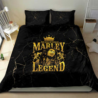 Black bedding set with two pillowcases and gold Marley Legend design centered on duvet