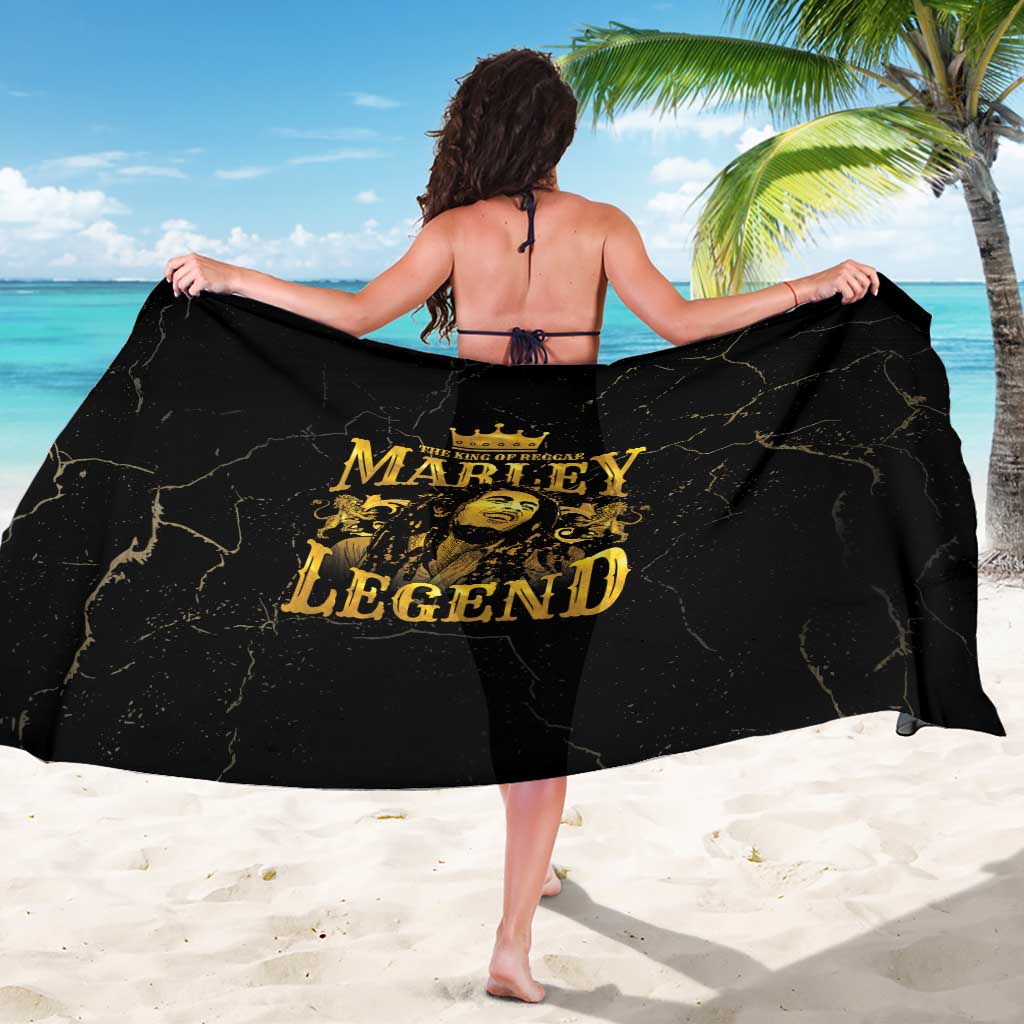 Black sarong with gold 'Marley Legend' text across back, tied at neck.