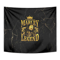 Close-up black tapestry with gold Marley Legend logo and crowned head